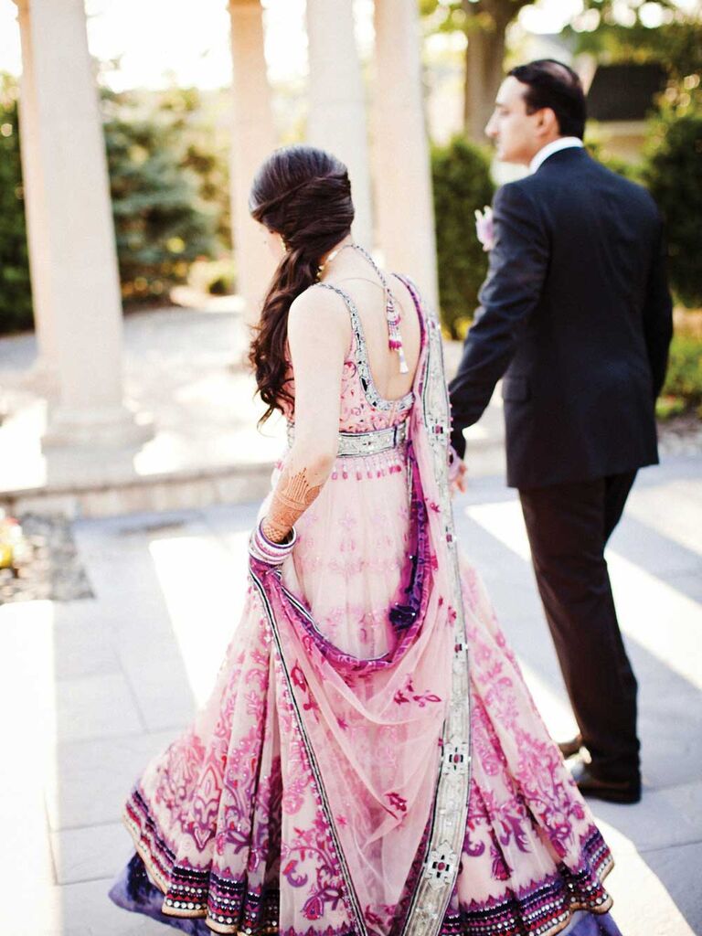 This bride switched between a pink lehenga and a white dress for