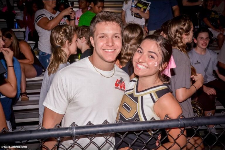 Julia cheering at a Plant Football game during her senior year of high school