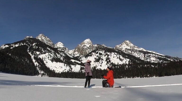 The proposal on frozen Bradley Lake in front of the Grand Teton