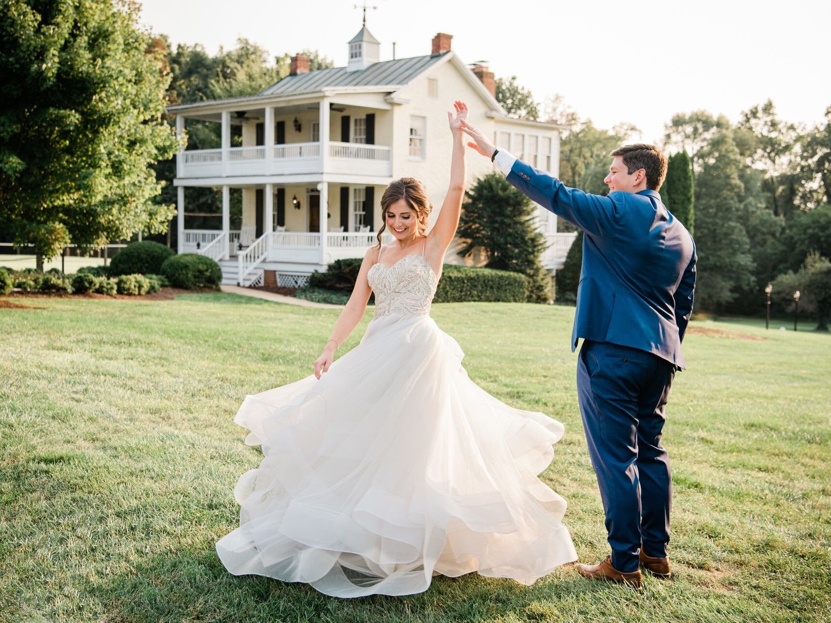 Couple dancing on the manicured ground of the b&b