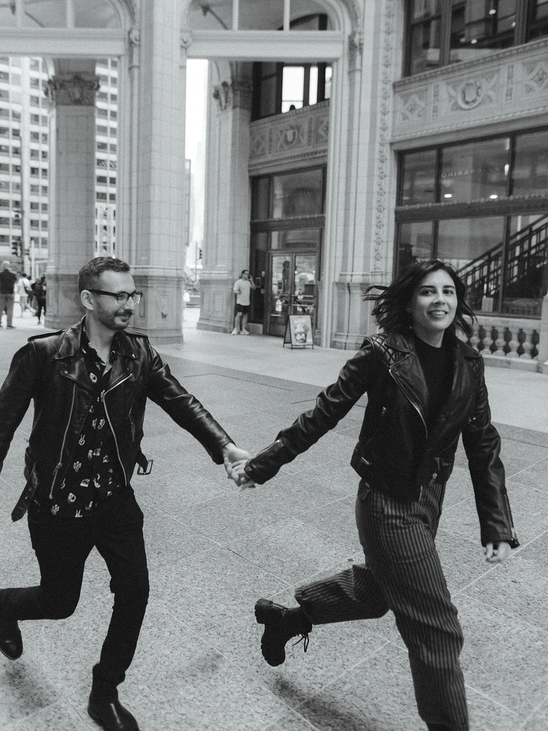 Couple holding hands and walking around city