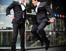 Grooms jumping for joy