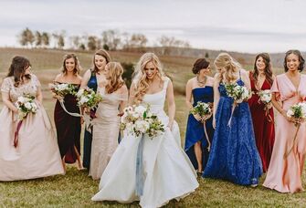 Beautiful bride walking with bridesmaids