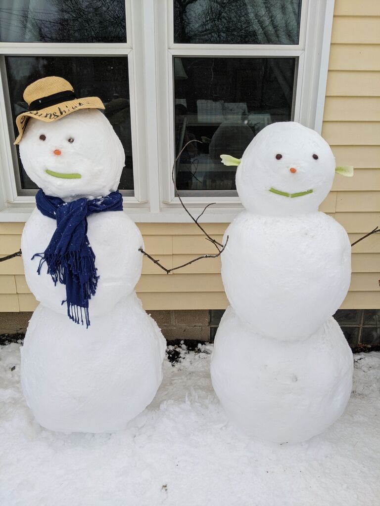 When life gives you snow, make snowmen and snow angels. After getting snowed in at Rachel's house in Roeland Park on New Year's Day, 2021, we made snowmen and snow angels in her front yard! 