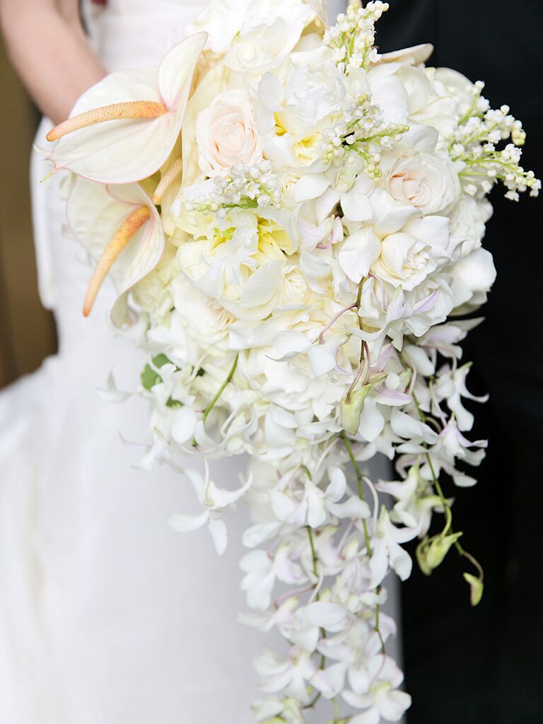 White cascading bouquet with orchids, lily of the valley and anthurium
