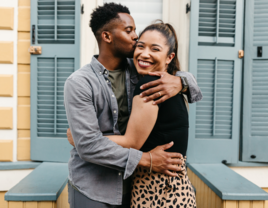 Couple hugging in front of proposal spot in Louisiana