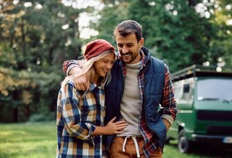 Happy young couple walking with each other