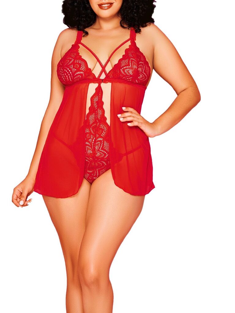 Model wears a sexy red bodysuit with lace detailing. 