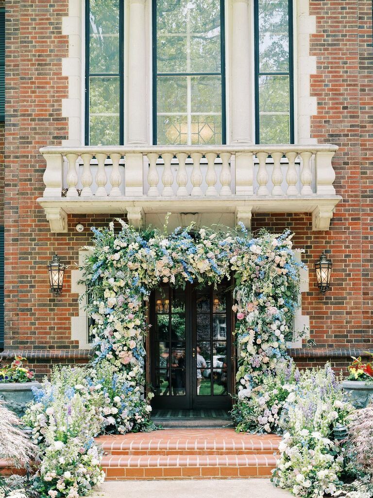 Wedding entrance covered in colorful floral arch
