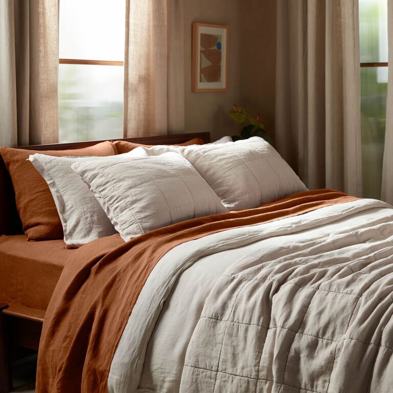 Neutral-hued bedding that's made from eco-friendly materials and processes
