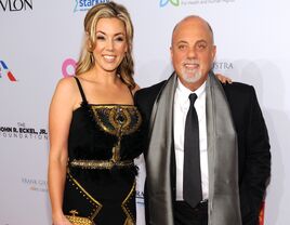 Billy Joel and Alexis Roderick pose at an event