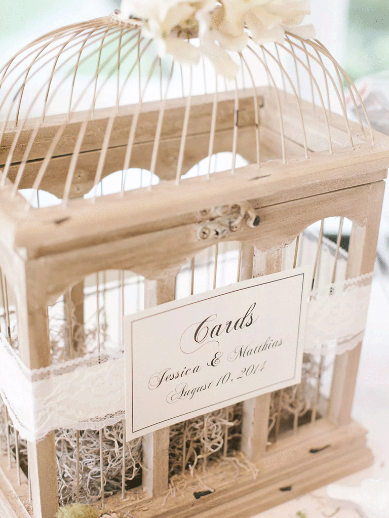Vintage white birdcage as wedding card holder. 