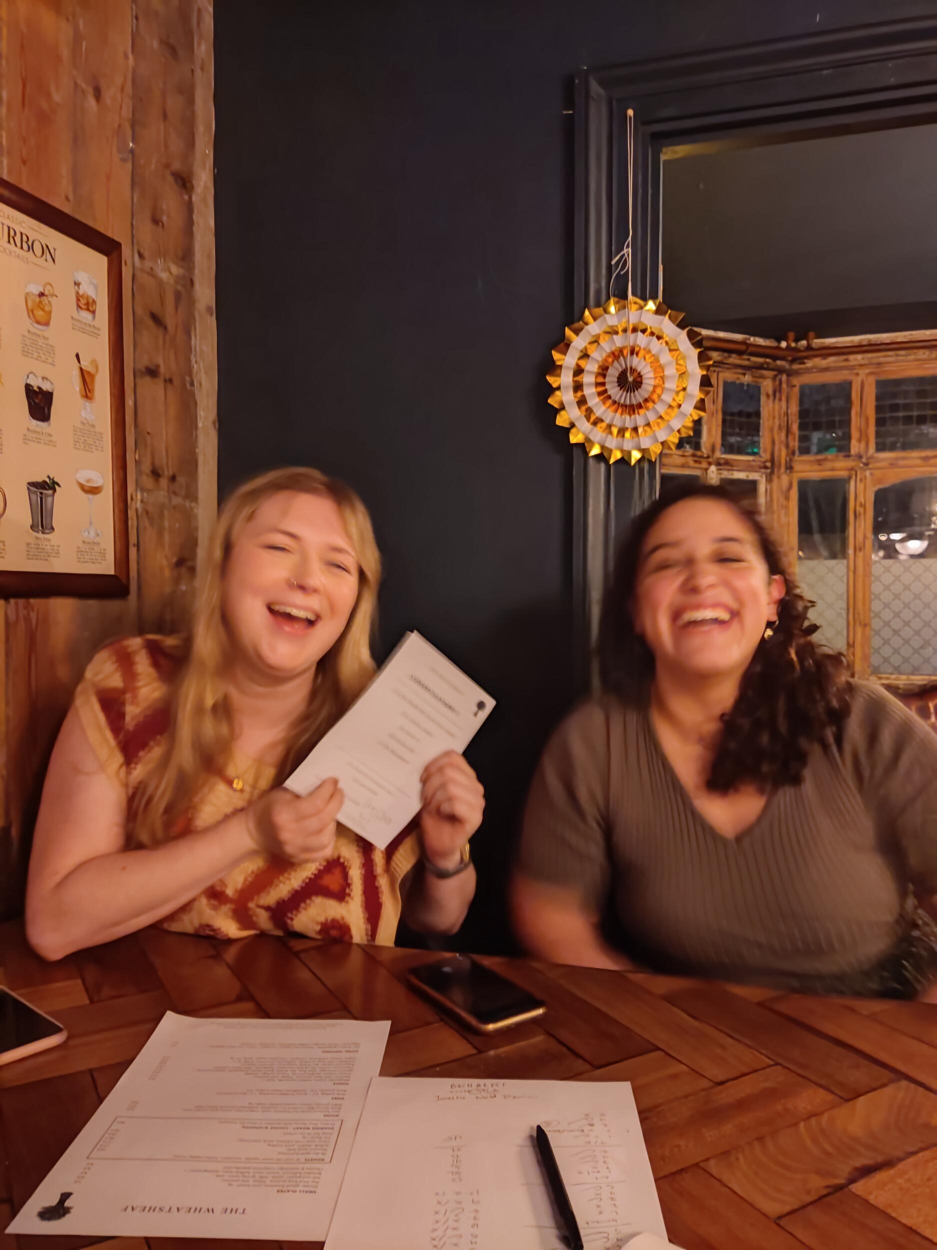 Dominating a pub quiz in London during Christmas. Joyce and Louise celebrating the fact that we should have come first, if only there hadn't been a TikTok music round.