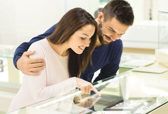 Couple picking out an engagement ring