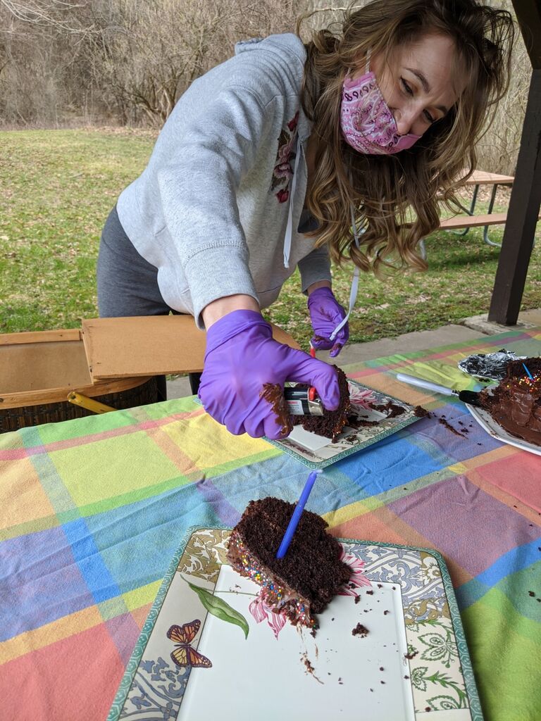 Finally, on April 19th we decided to meet each other in person. We went to Mendon Ponds park and had a 6 feet apart date with masks and gloves.  We had learned that both of our birthdays were coming up and surprised each  other with little gifts on the date. I made Luke a chocolate cake and he made me a hand-painted sign with a quote from one of my favorite videos.  In retrospect, his gift was way better than mine because Luke doesn't even like chocolate cake and my sign still hangs proudly in our house, but it's the thought that counts!