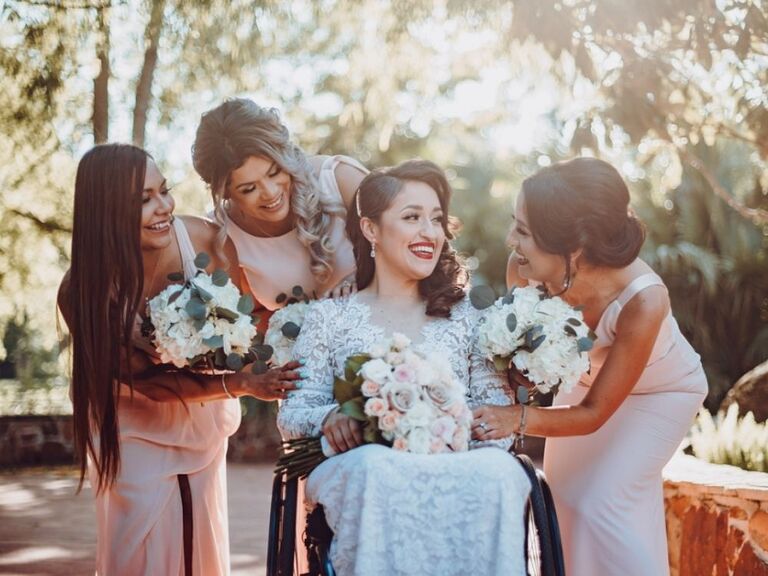 bride and bridesmaids holding hydrangea and eucalyptus wedding bouquets