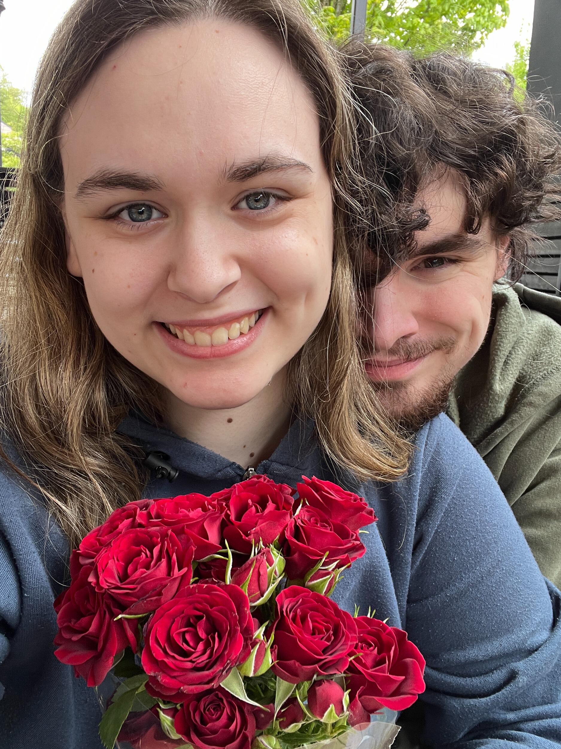 Our 6 month anniversary. He brought her a bouquet of red roses (her favorite) when she told him she had never received flowers.
