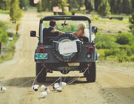 Old jeep getaway car for the bride and groom