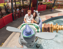 Couple riding on Dumbo at disney world