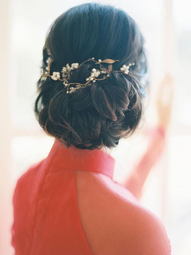 Braided low bun with accessories wedding updo for long hair