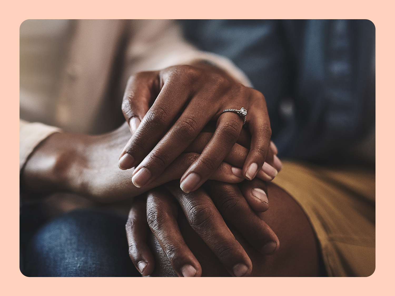 Close-up of couple interlocking hands 