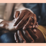 Close-up of couple interlocking hands 