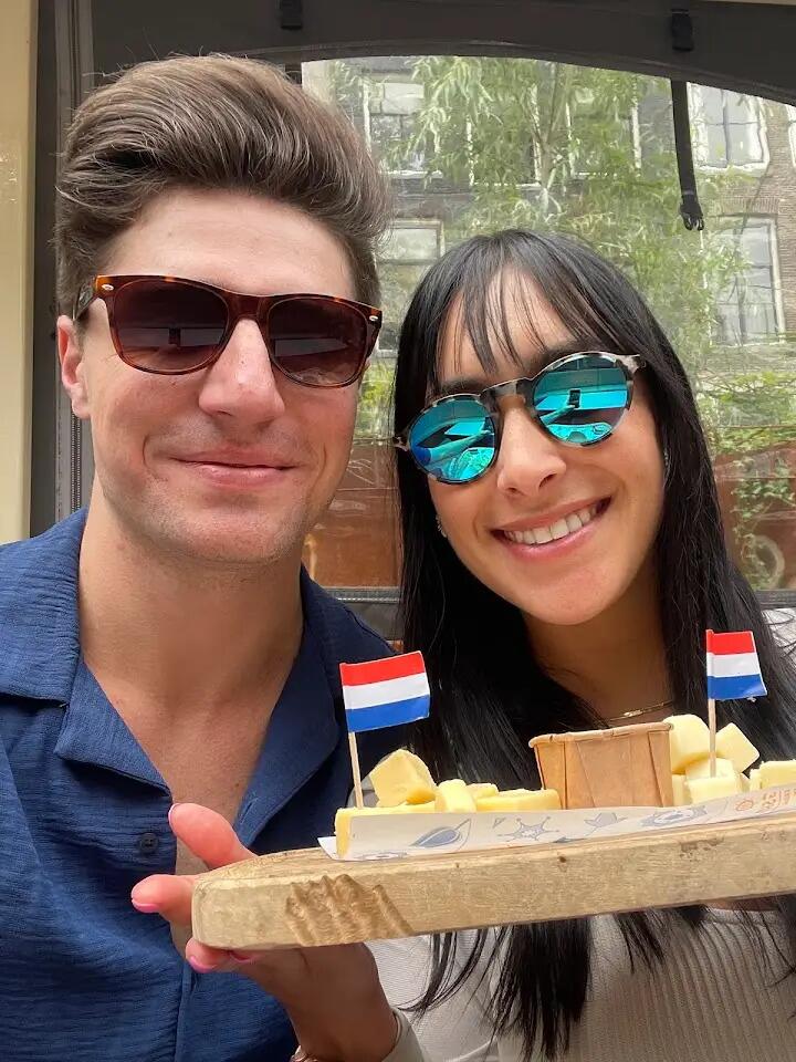 Stop 2 - Amsterdam, Netherlands. The couple takes a boat tour through one of the city's iconic canals! 