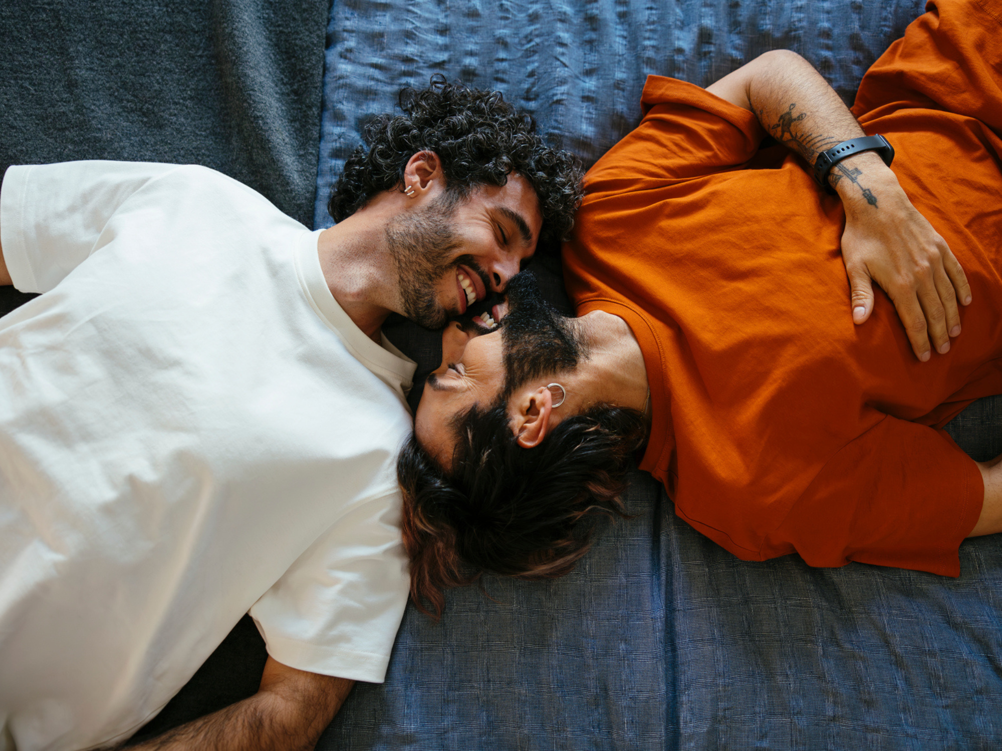 Couple laying on bed together