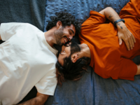 Couple laying on bed together