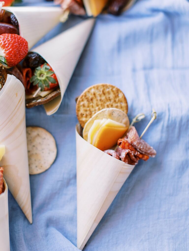Charcuterie meat, cheese and cracker cones for your wedding food ideas