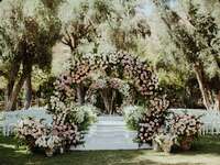 rose covered wedding ceremony arch 