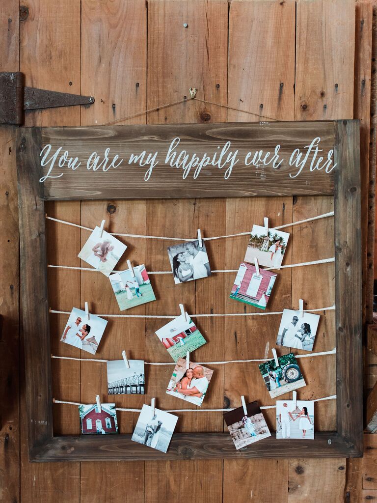 rustic wood photo display and wedding sign