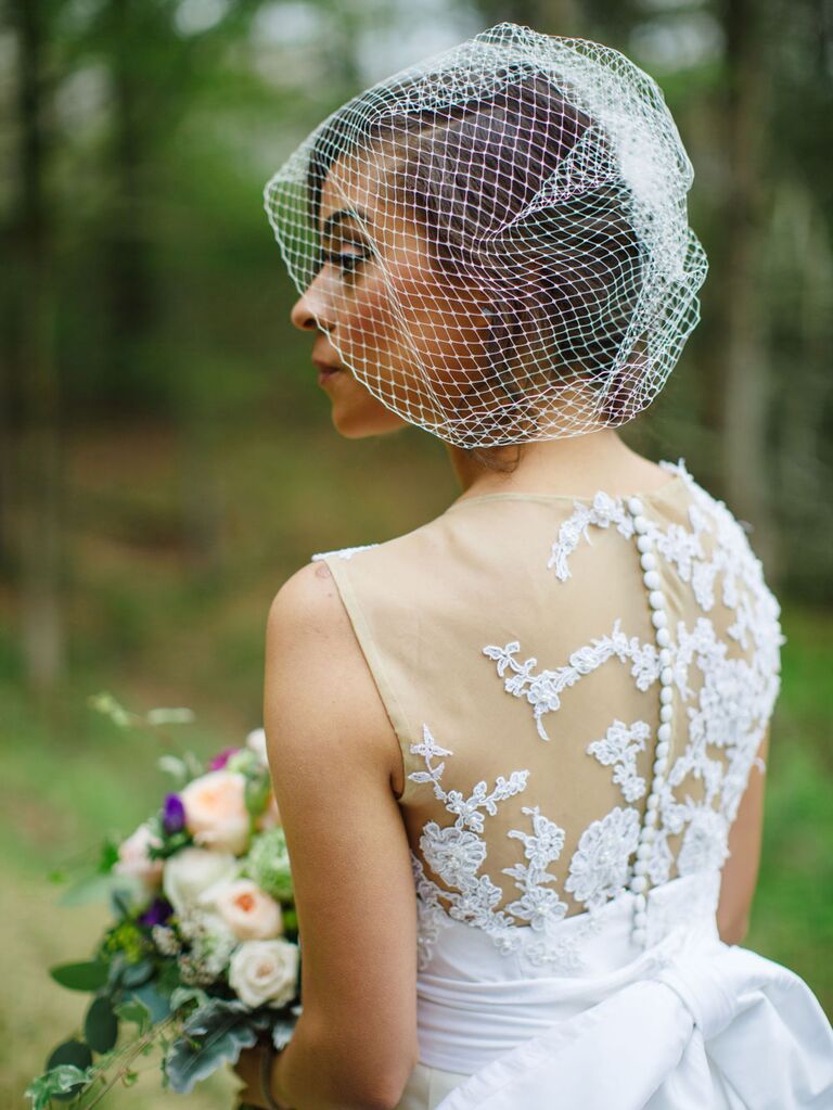 Bride wearing vintage birdcage veil