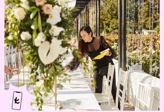 Wedding coordinator fixing the reception tables