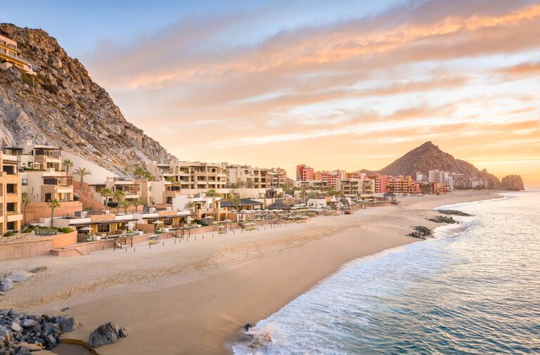 gorgeous mexico honeymoon resort at sunset in cabo mexico with pacific waters
