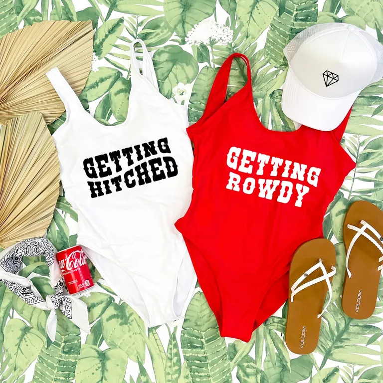 red one piece that says 'getting rowdy'