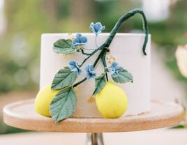 single-tier summer wedding cake with lemon decorations