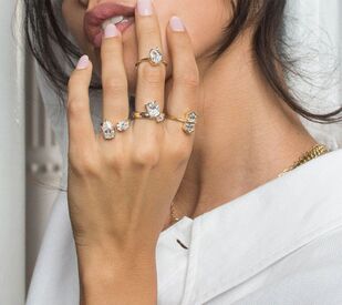 Woman wearing multiple engagement rings