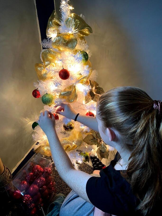 Decorating our first tree together! Don't worry, we've upgraded since this :)