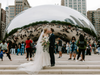 Married couple kissing outside of bean in Chicago, how to get married in Illinois