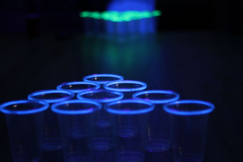 Glow in the dark beer pong - neon themed party ideas