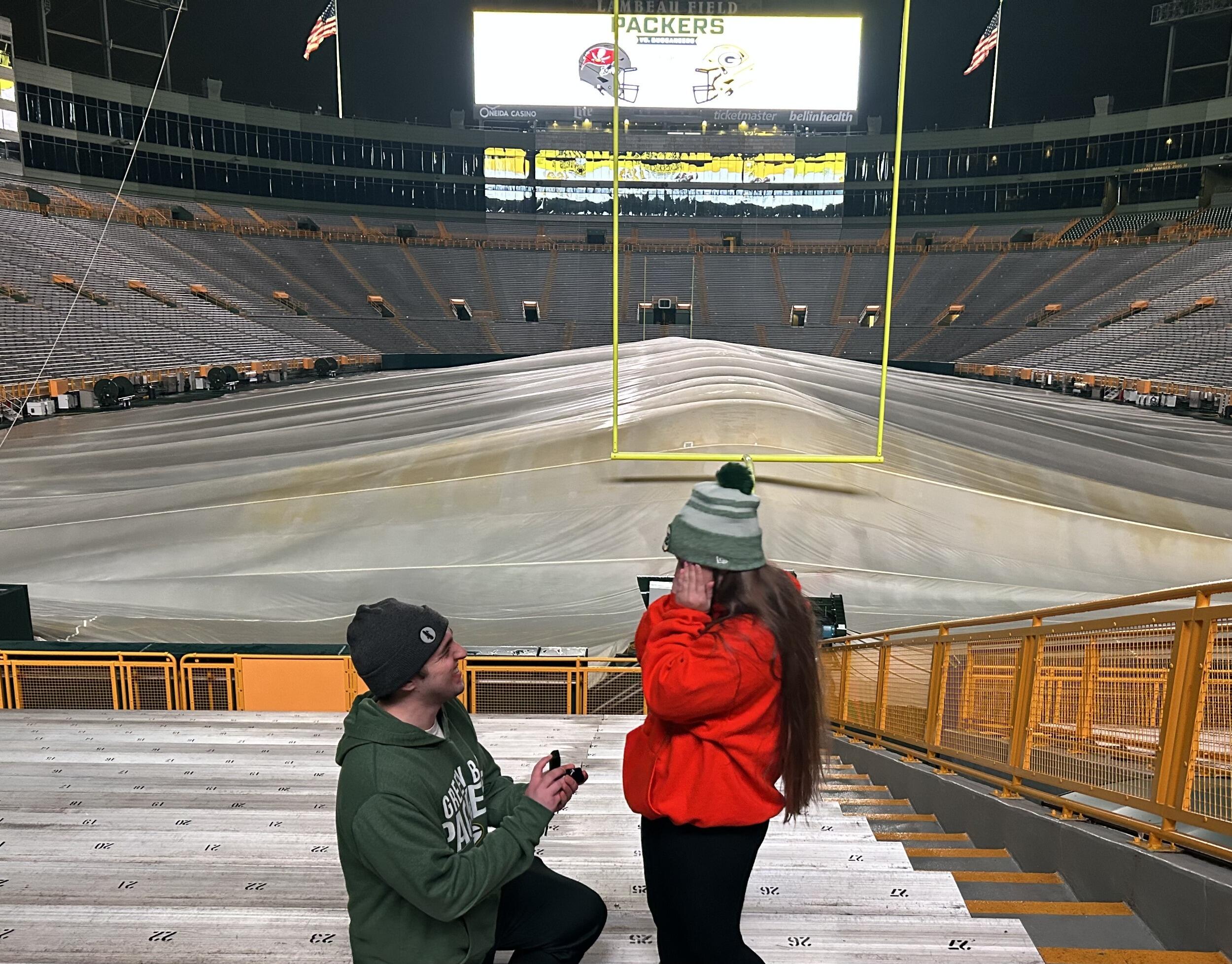 Peyton proposed to Aleighna in the middle of the stadium tour, to bad they had the field tarped over due to the rain.
