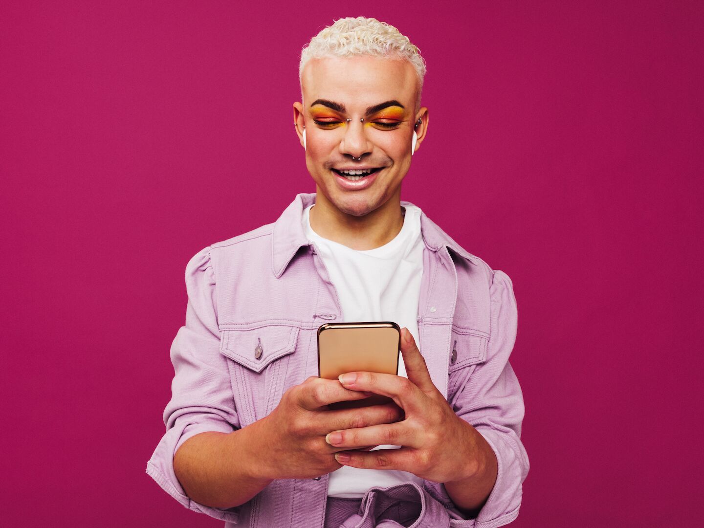 Queer man on his phone
