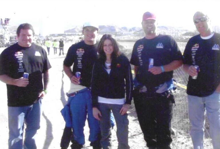 SCORE Laughlin Desert Challenge. Brady was with Andy McMillin's team that was sponsored by Red Bull. Jenn was working for Red Bull driving the car with the can on top. Jenn's co-worker and friend told Jenn to take a photo with them. Little did they know... In the photo is Matt Martelli, Andy McMillin, Jenn, Brady and Derek Thompson (Brady's Dad.)