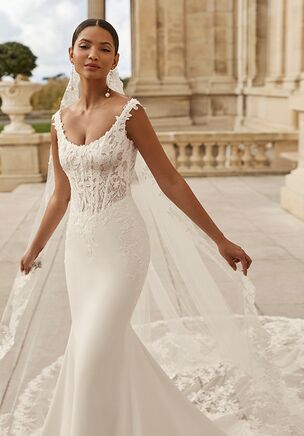 Mermaid silhouette wedding dress, round neckline with straps, lace bodice, bi-elastic crepe skirt and corset back.