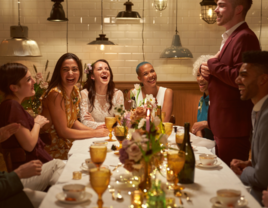 Guests and couple enjoying themselves at an engagement party