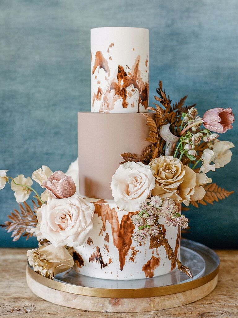 Fall wedding cake with muted neutral hues of brown, tan, cream and blush pink