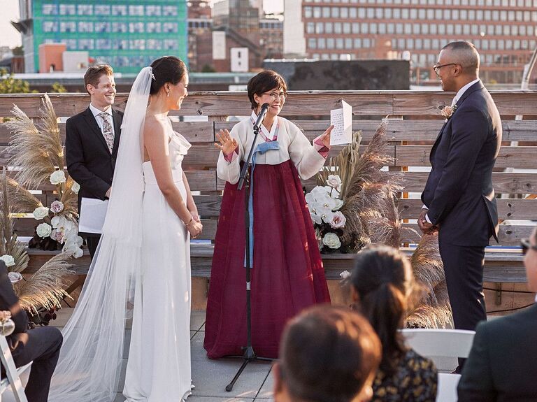 Mother-of-the-bride giving a blessing during Korean wedding ceremony