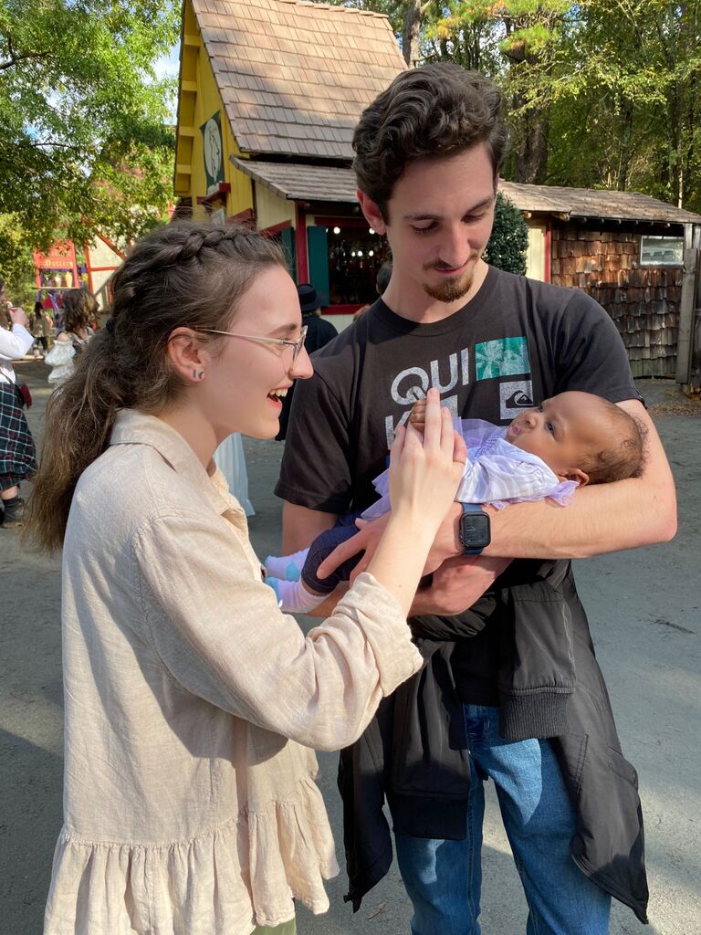 Who knew a little adventure could include learning to hold a baby!