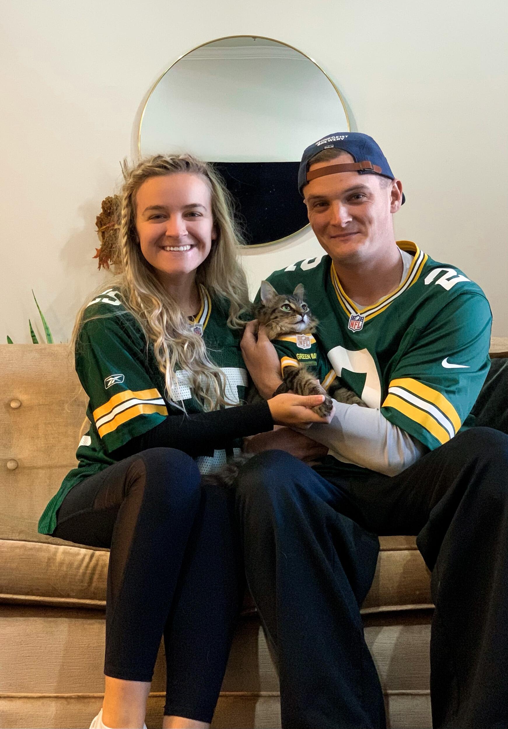 Family picture in our Packers jerseys after we got Milo his (which he has now outgrown).